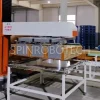 Full Layer Palletizer, Dual-station Column Rotary Palletizing Machine, Equipped with Custom Integrated Gripper, for 2KG Boxed Instant Noodles, with CE certification. SPIN's Column rotating palletizer: Dual-station, continuous operation, no speed loss.